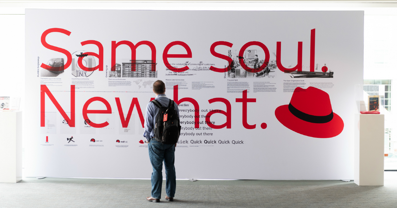 A wall at Red Hat Summit features very large text that reads 