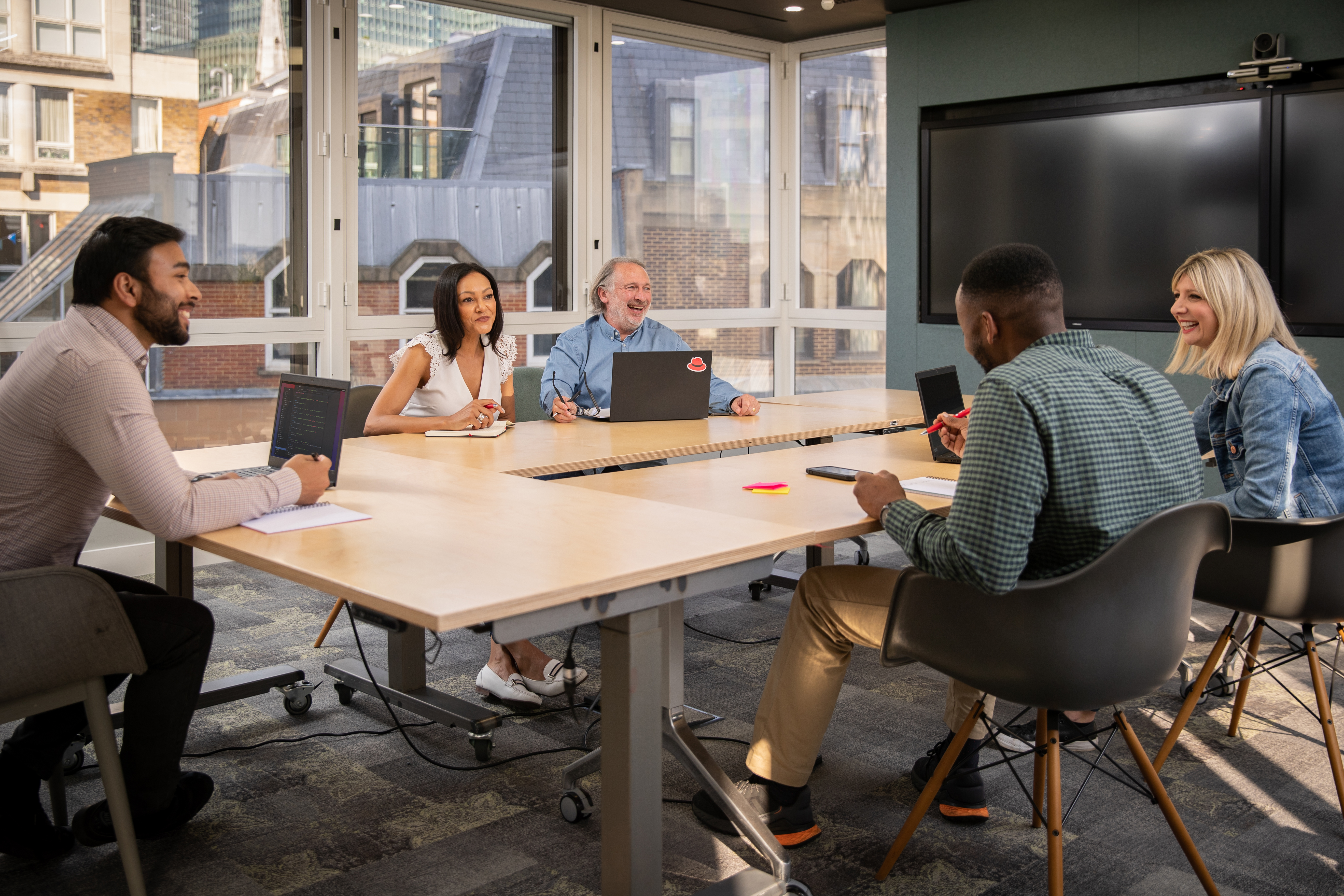 red hatters sitting around table