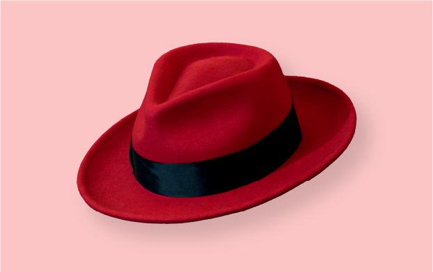 A photo of a Red Hat fedora with dramatic lighting.