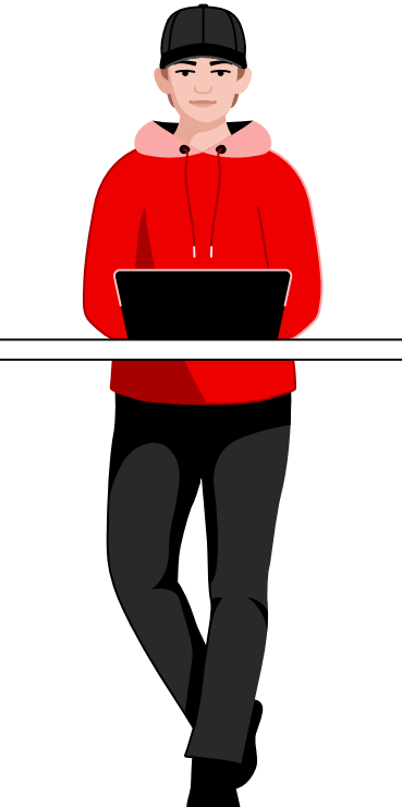 Young person in red sweatshirt and black pants, standing and working on a black laptop on a table