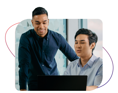 Coworkers viewing laptop