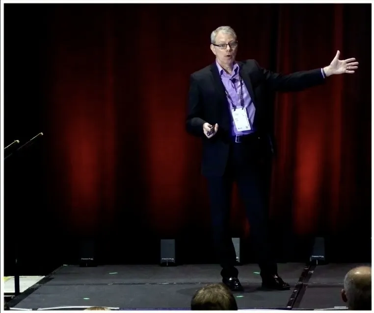 Image 1: Brian Cook, Director of Kubernetes Site Reliability Engineering & Kubernetes Security Posture Management,  with DTCC speaking at the OpenShift Commons Gathering in Atlanta, GA